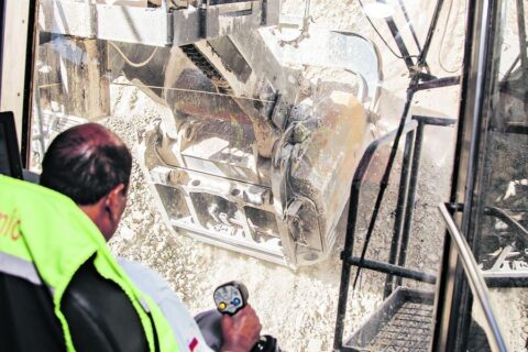 Plusmining, man driving an extraction truck